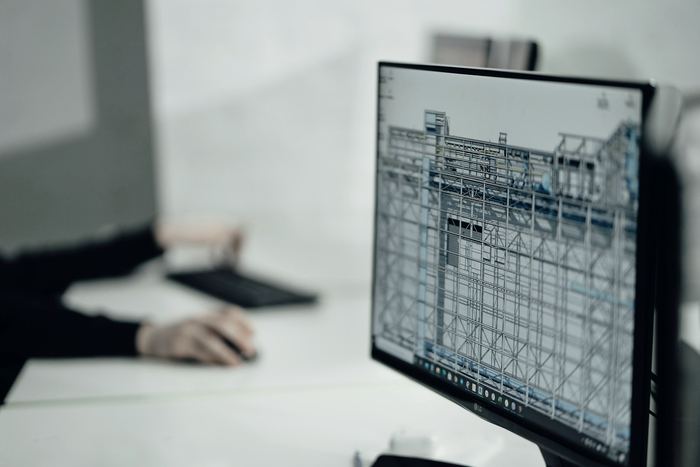 Person at desk viewing monitor