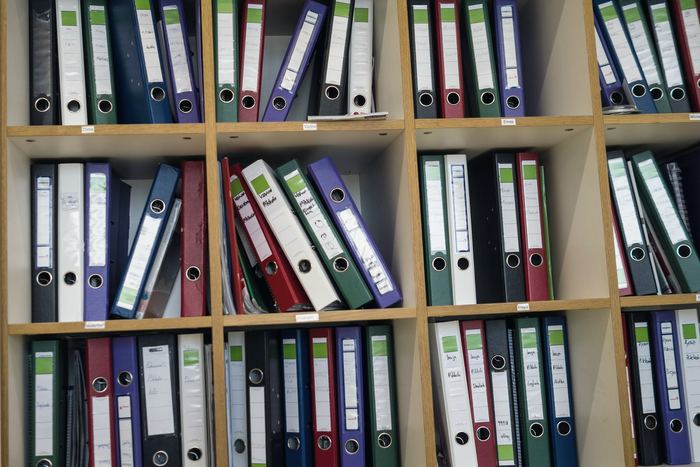 Shelves filled with colorful binders and folders