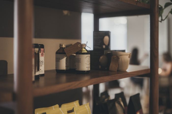 Stock arranged on the wooden shelves of a small shop