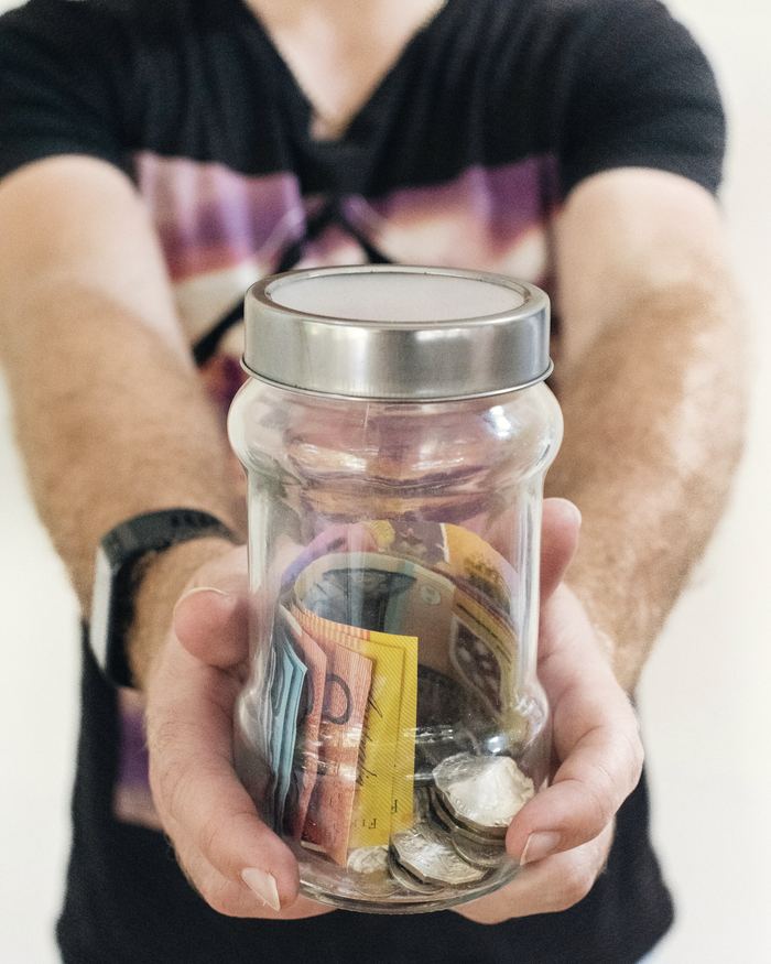 Man holding clear glass jar