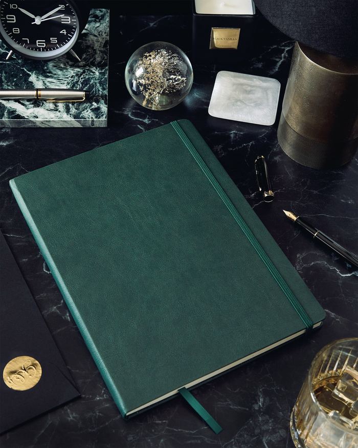 Green book on black table
