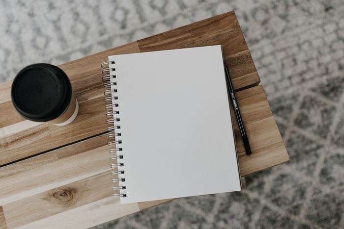 White printer paper on brown wooden table